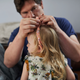 Father styling child hair